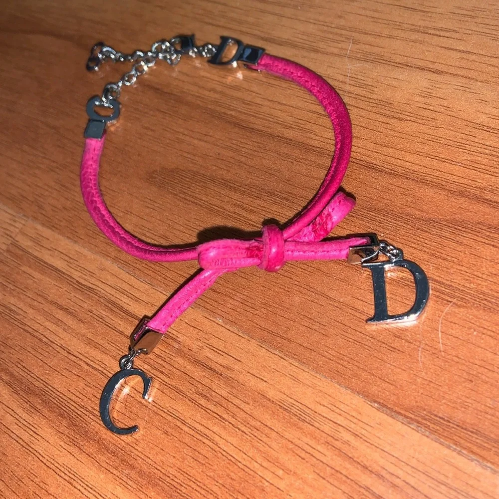 Authentic Christian Dior Leather and Metal Charm Bow Bracelet - Picture 2 of 11
